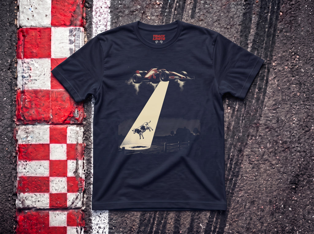 Alien Abduction F1 t-shirt in Navy, flat lay on a race track kerb