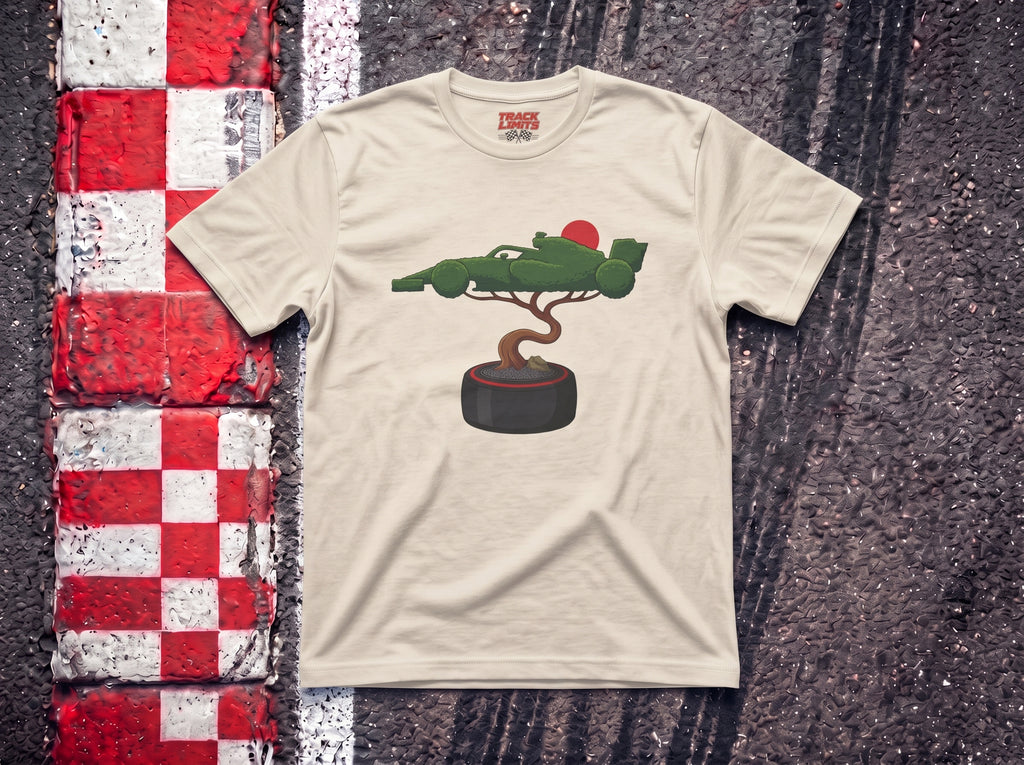 Bonsai Tree F1 t-shirt in Natural, flat lay on a race track kerb