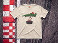 Bonsai Tree F1 t-shirt in Natural, flat lay on a race track kerb