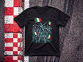 Kimi Italian Celebration F1 t-shirt in Black, flat lay on a race track kerb